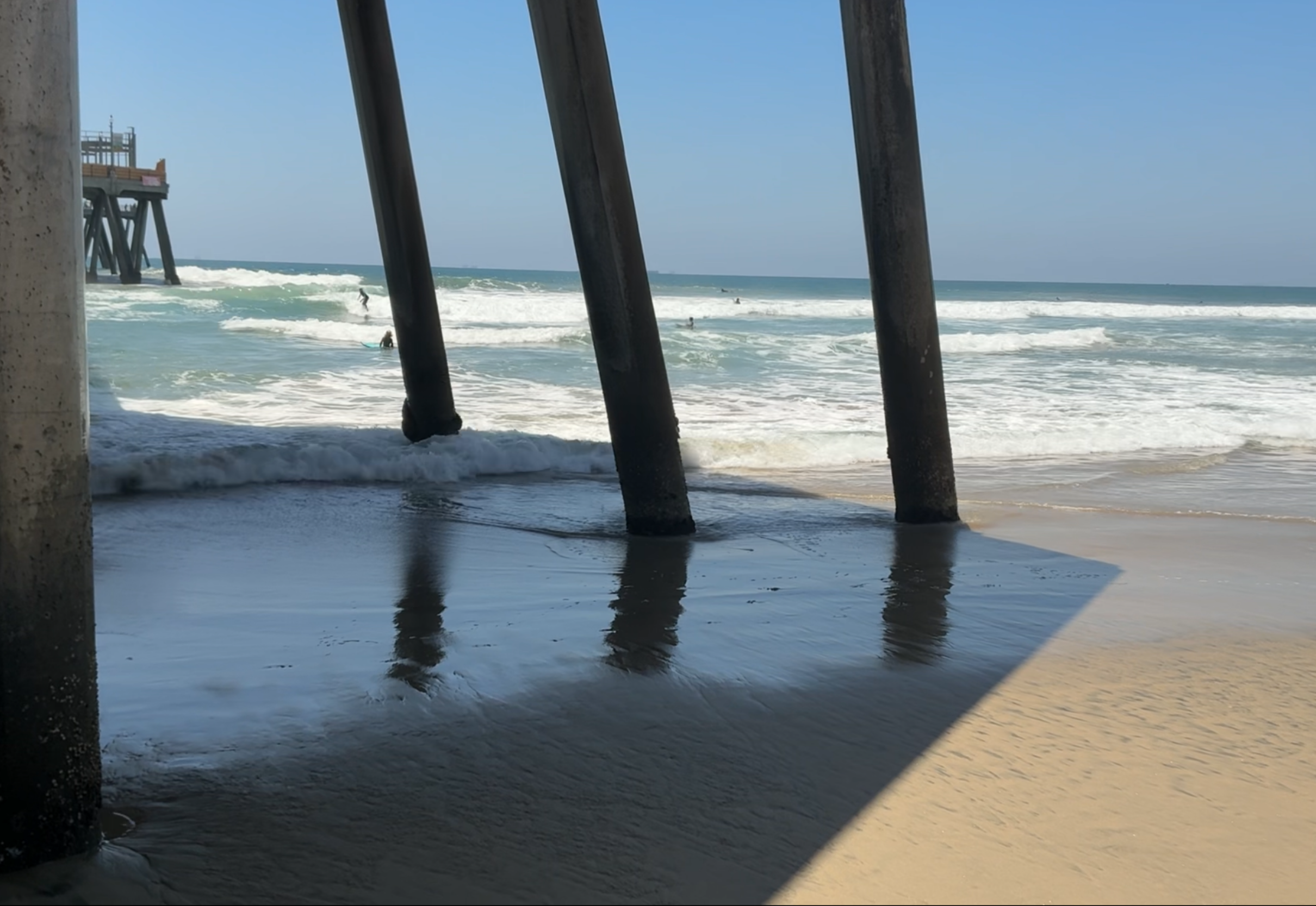 Surfers near the pier